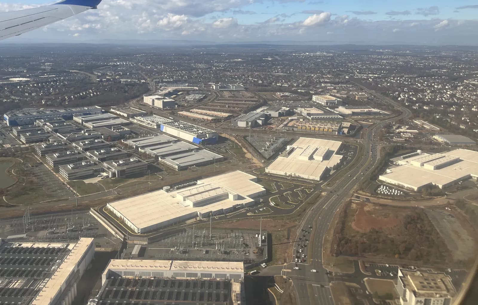Aerial view of large data center buildings and construction sites in Ashburn, Virginia